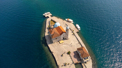 Top view of the island near Perast of the church of our lady of the rocks. Aerial landscape of tourist attraction in the Bay of Kotor, Montenegro