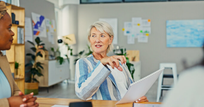 Discussion, documents and business woman in meeting for campaign manager, branding report and research. Feedback results, review and brainstorming with mature employee in office for creative startup