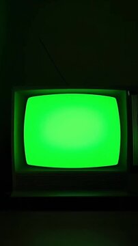 A vintage green screen TV set against a retro-inspired background, artistically generated by AI to evoke nostalgic vibes Vertical 9 16..