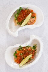 Mini appetizers with red caviar, appetizer idea for a festive table