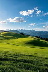 Obraz premium arafed view of a green field with mountains in the distance