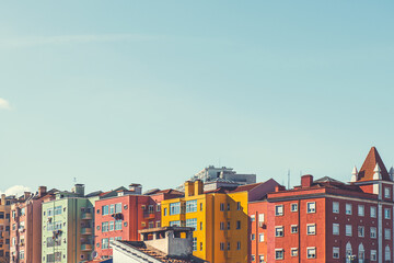 Colorful architecture in Lisbon, Portugal. Red and yellow houses and the blue sky at sunny day.