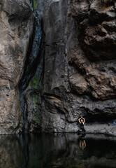 Woman tourist in cave on Gran Canaria island, Spain. Wild Nature of the Canary Islands.