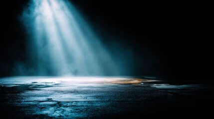 Dramatic spotlight illuminates wet asphalt surface in urban scene creating moody atmosphere with dark background and cinematic visual effect for creative projects
