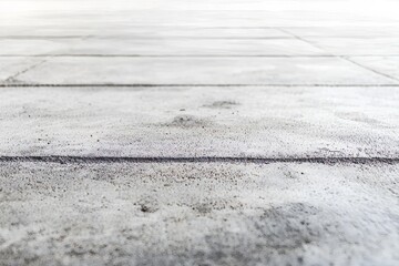 Low-angle view of a light gray concrete slab floor.