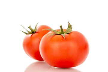 Red juicy tomatoes, close-up, isolated on white background.