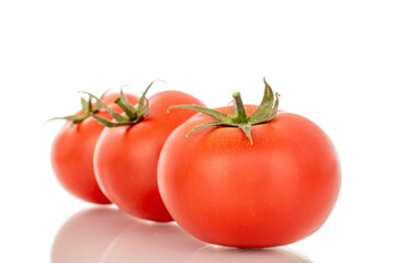 Red juicy tomatoes, close-up, isolated on white background.