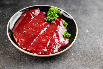 Raw liver beef veal meat steak liver grill appetizer vegetables dish fresh delicious gourmet food background on the table rustic food top view copy space keto and paleo diet