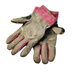 Worn work gloves with a striped design and pink accents, showcasing their rugged texture and practical use.