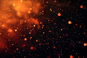 Obraz premium Abstract orange and black bokeh background with glowing particles creating a warm, dynamic effect.