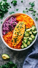 Vibrant fish bowl with rice avocado mango cabbage and cilantro on rustic surface overhead shot healthy food concept balanced diet delicious meal