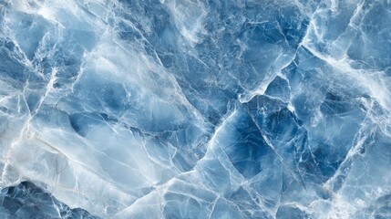 Obraz premium Close-up of blue marble texture with swirling patterns and veins.