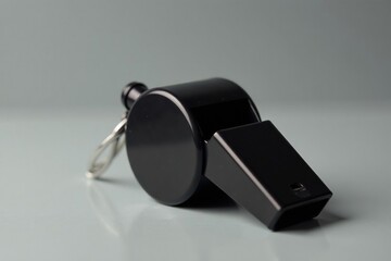Classic black plastic whistle, simple design, clean background , simple, peaceless, tool