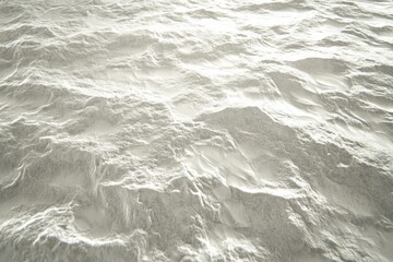 Obraz premium High-angle view of textured, light-gray surface resembling mountainous terrain.