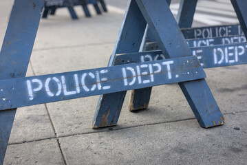 police dept sign on blue nypd barricade on sidewalk in brooklyn new york city (cops crime criminal event) closed street traffic cop department cordoned off barrier