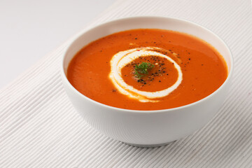 Tomato Soup garnished with fresh cream 