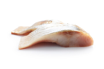 Pieces of delicious herring isolated on white