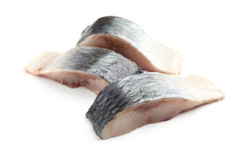 Pieces of delicious herring isolated on white