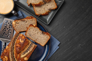Cut banana bread with nuts, server and coffee on black table, flat lay. Space for text