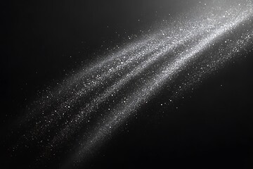 Obraz premium Abstract silver dust particles streaking across a dark background, creating a flowing and luminous effect.