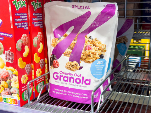 Crunchy oat granola cereal on store shelf with trix cereal box display