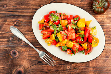 Delicious vegetable salad with fresh tomatoes.