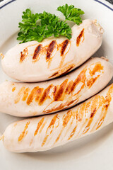 White sausage grill Bockwurst pork meat Bratwurst natural food vegetables dish organic product fresh tasty gourmet food background on the table rustic food top view copy space