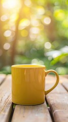 Bright yellow mug on a wooden table with a blurred green background.