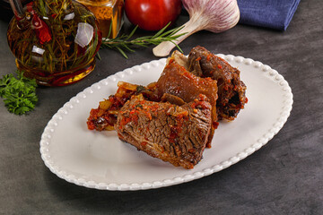 Baked beef ribs with vegetables