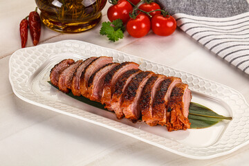Sliced duck breast baked with cherry