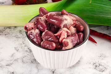 Raw chicken hearts in the bowl