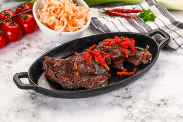 Baked beef cheeks with vegetables