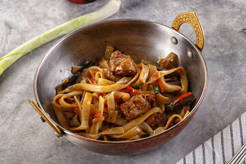 Asian cuisine udon with chicken and vegetables