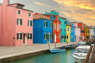 Colorful houses and canal at sunset in Burano