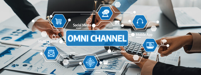 This image captures a team engaged in strategic omni-channel marketing, showcasing data analysis and collaboration to drive business growth and customer engagement. Amity