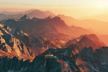 Naklejka premium Sunlit mountain ranges stretch across the horizon in a scenic vista of peaks and valleys