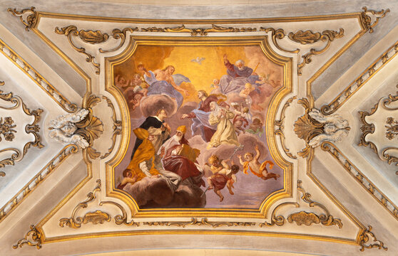PRATO, ITALY - MARCH 21, 2025: The ceiling fresco of Glory of St. Catherine in the church Basilica dei Santi Vincenzo e Caterina de Ricci by  Giovanni Antonio Pucci (1677 &ndash; 1739). 