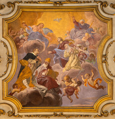 PRATO, ITALY - MARCH 21, 2025: The ceiling fresco of Glory of St. Catherine in the church Basilica dei Santi Vincenzo e Caterina de Ricci by  Giovanni Antonio Pucci (1677 – 1739). 