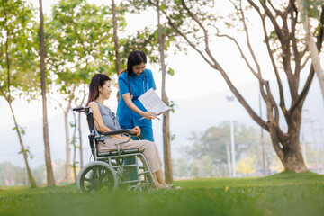 Fototapeta premium Amid the calming greenery of the hospital’s garden, a caring female physician provides thoughtful consultation and guidance on treatment for her patient.