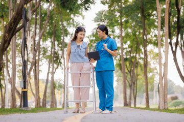 Fototapeta premium Amid the calming greenery of the hospital’s garden, a caring female physician provides thoughtful consultation and guidance on treatment for her patient.