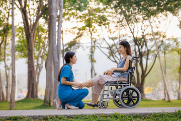 Obraz premium A devoted female physician lovingly cares for her elderly wheelchair-bound patient, offering support and attention with the warmth of a family member.