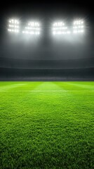 Obraz premium A green field under bright lights with a dark background of stadium seating