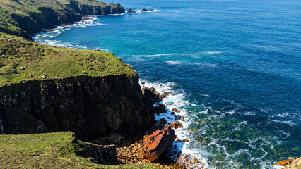 Rusted Boat wreck at coast of south england from aerial view.