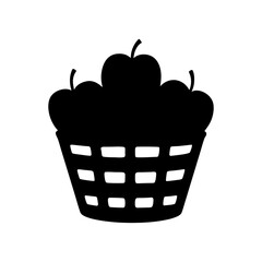 Silhouette image of a basket overflowing with delicious ripe red apples