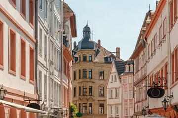 A street in Mainz Rheinland-Pfalz Germany with a building in the middle with a clock on it