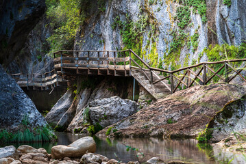 Scenic wooden walkway through the Cerrada de El&iacute;as gorge, along the Borosa River, in the Sierra de Cazorla, Ja&eacute;n, Spain.