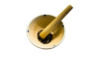 grinding bowl with black and white sesame seeds