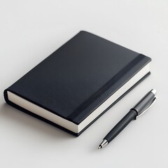 Elegant black notebook with a sleek pen resting beside it on a clean, minimalistic surface