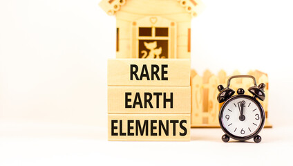 Rare earth elements symbol. Concept words Rare earth elements on beautiful wooden block. Black...