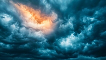 Obraz premium Dramatic stormy cloudscape with intense color contrast and texture. The image evokes a sense of power and impending weather. 